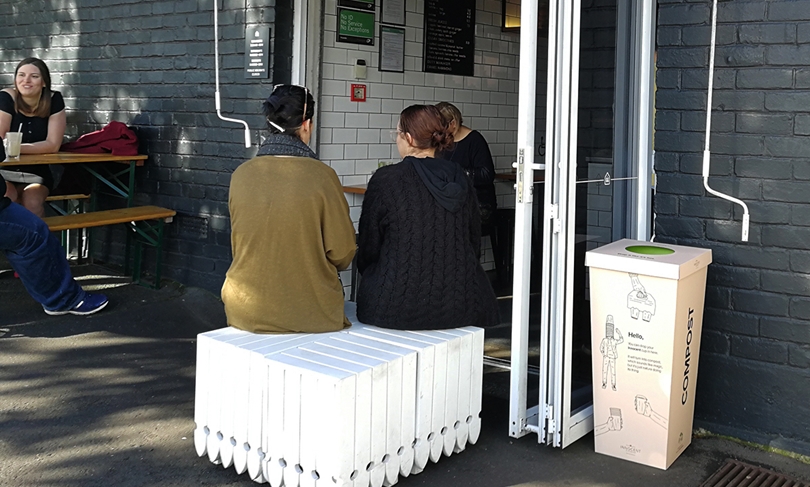 A compostable cup bin sits outside an Auckland cafe