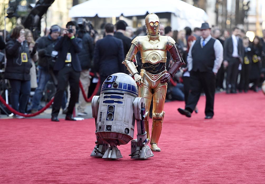 C3PO and R2-D2 arriving on the red carpet at the Los Angeles world premiere of Star Wars: The Force Awakens.