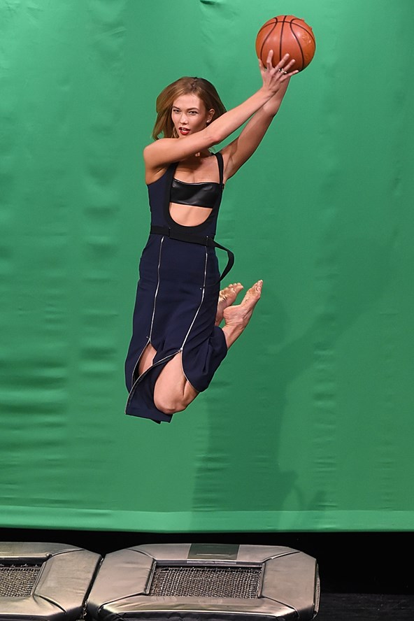 Karlie Kloss demonstrates her modelling talents during an appearance on The Tonight Show Starring Jimmy Fallon, teaching the talk show host to pose mid-air.