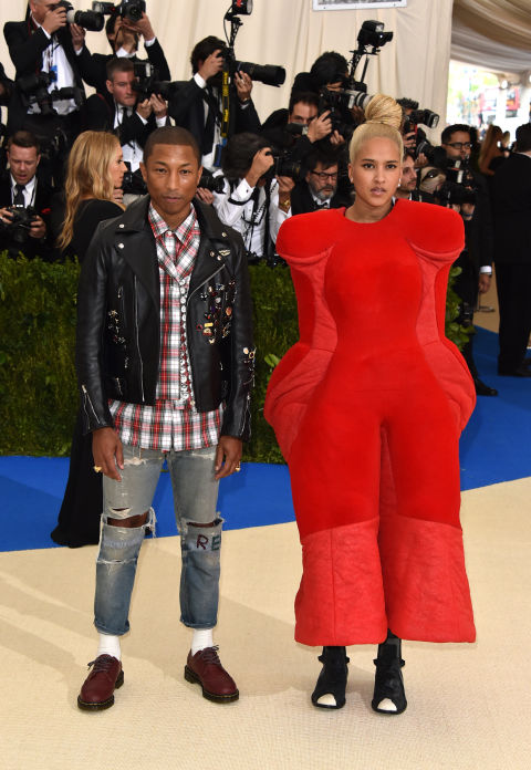 Pharrell Williams and Helen Lasichanh wearing Chanel and Comme des Garçons.