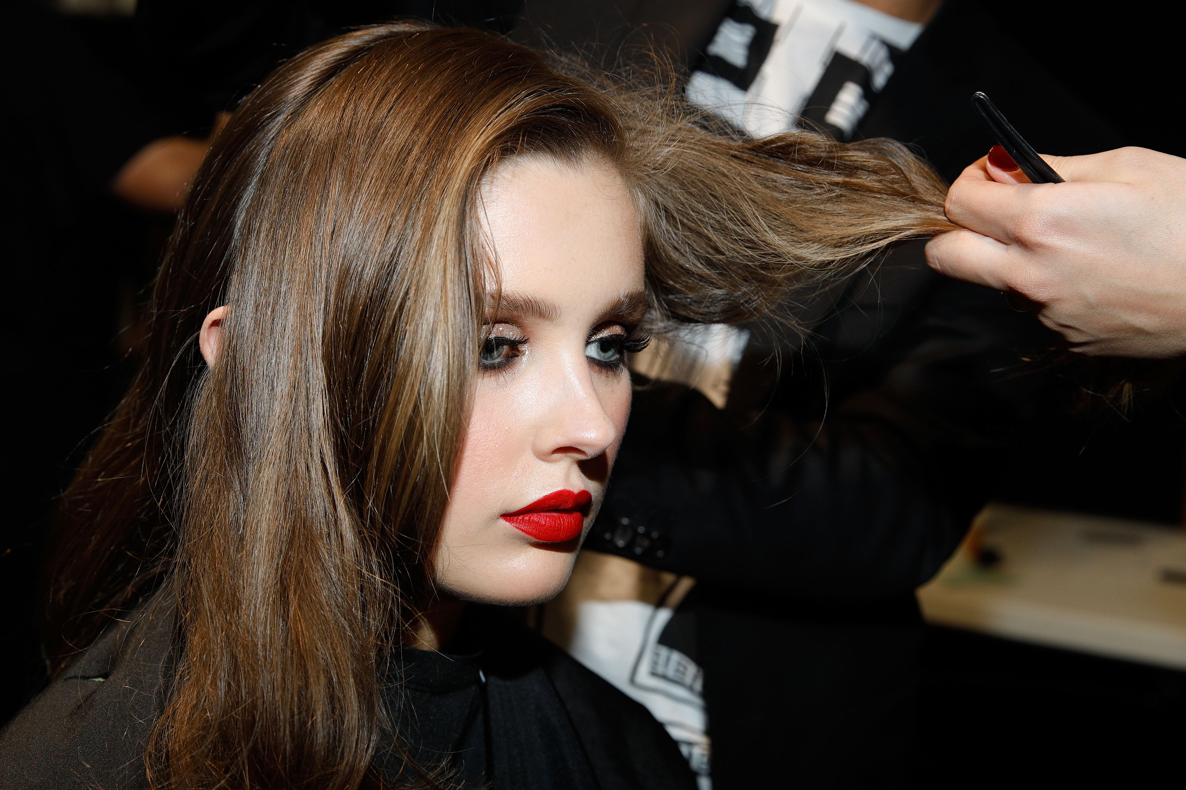AUCKLAND, NEW ZEALAND - AUGUST 29:  A model prepares backstage ahead of the Kathryn Wilson show during New Zealand Fashion Week 2018 at Viaduct Events Centre on August 29, 2018 in Auckland, New Zealand.  (Photo by Michael Ng/Getty Images)