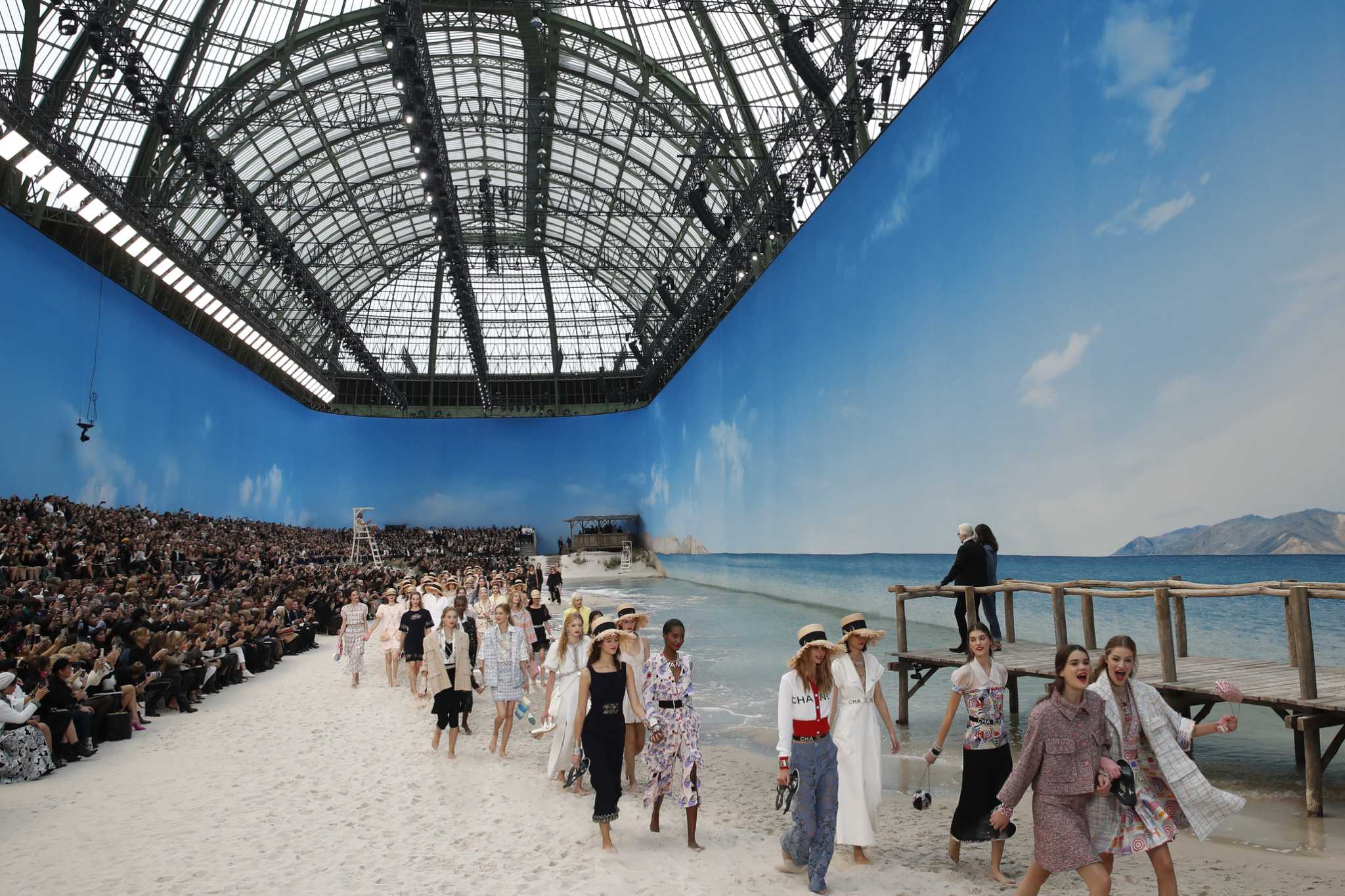 Models wear creations for Chanel Spring/Summer 2019 ready-to-wear fashion collection in Paris, Tuesday, Oct.2, 2018. (AP Photo/Christophe Ena)