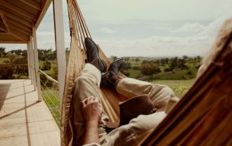 man lying on hammock