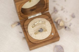 Gold rings in a wooden jewellery box