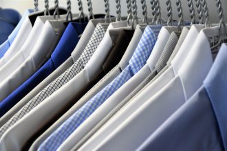 Line of mens shirts on hangers