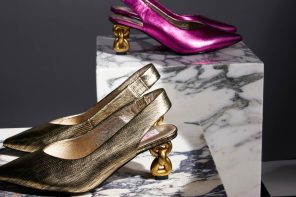 Two pairs of slingback heels. One is metallic pink and one is metallic pink. Both have a pointed toe and a chain heel.